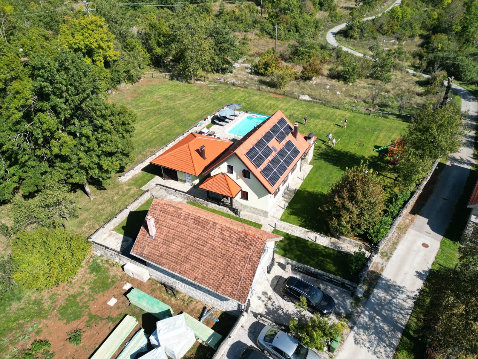 The villa, pool and garden from the air