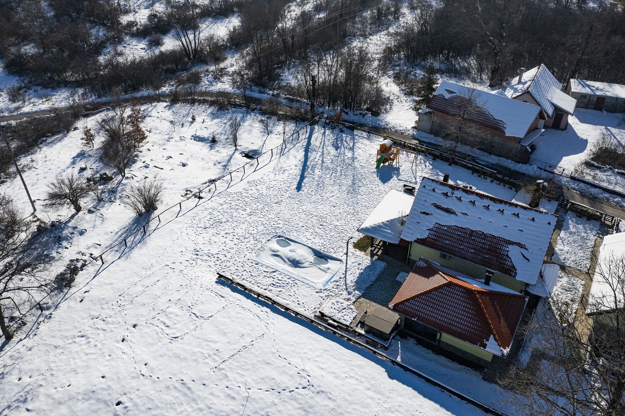 The villa and the village under snow, from the air